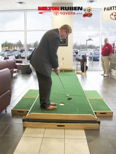 Our new GM, Chuck Easters, gave the putting green a swing to warm it up...